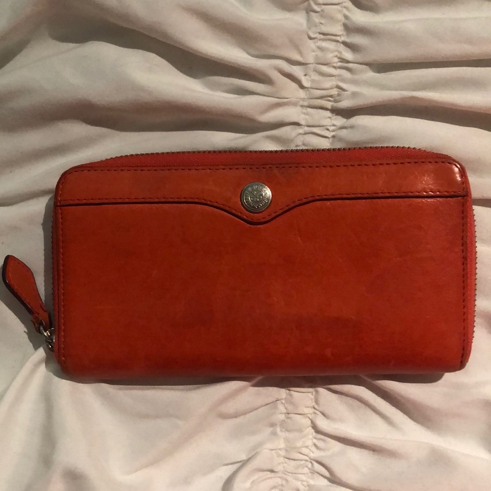 Rebecca Minkoff burnt orange leather wallet.